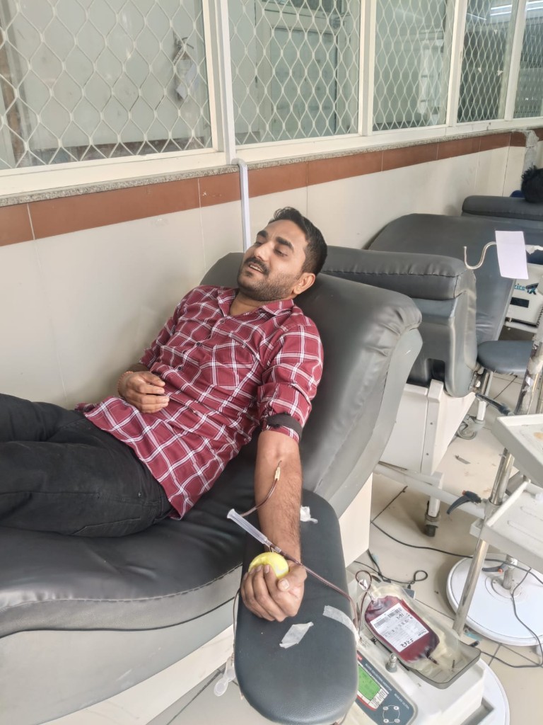 Blood donation in progress at center
